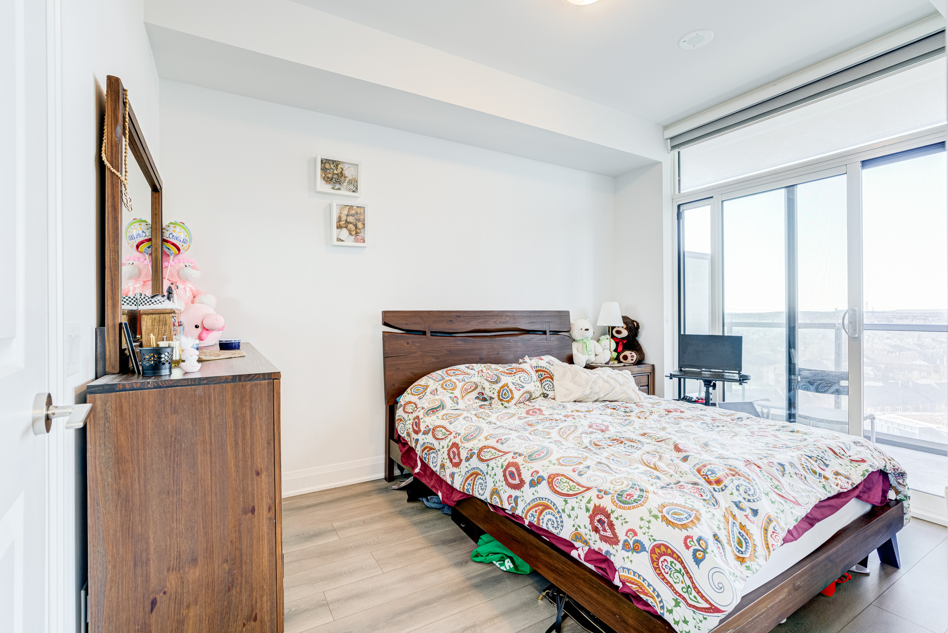 Primary bedroom with floor-to-ceiling windows